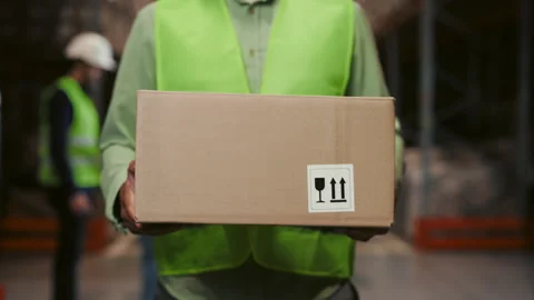 Worker Hands Holding Cardbox in Warehouse, Walking in Logistic Centre. Stock Footage 245525059