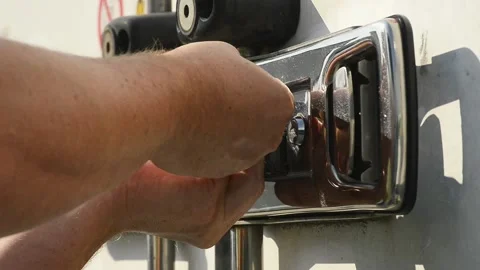 Worker hands installing plastic security seal on truck lock Stock Footage 341087976
