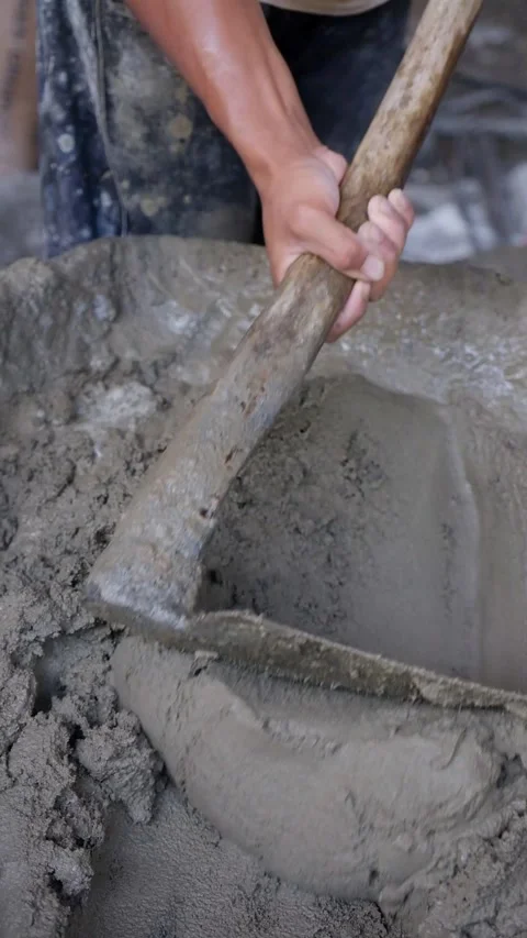 Worker Hands Mixing Cement and Sand Mortar in Basin for Building Construction Stock-Footage 342883021