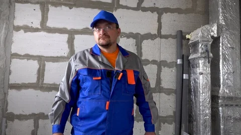 Worker in the hands of a sledgehammer is very angry and beats Stock Footage 115419535