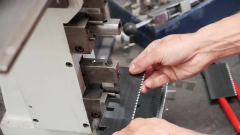 Worker hands using punch press to process steel plates - close up Video stock 157968083