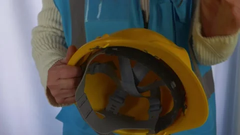 Worker with hard hat and visibility vest Stock Footage 166054967