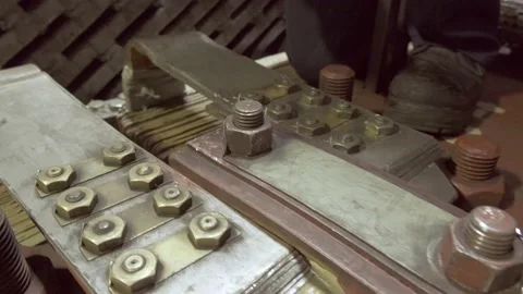 A worker in a hard hat repairs a mechanism Stock Footage 226715300