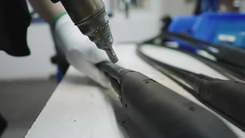 Worker heating cable protection insulation head during manufacturing of elect 库存影片 331891548