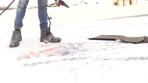 Worker Heating Cement with Blowtorch Stock Footage 167266503