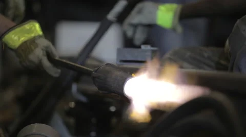 Worker heating up steel rail using torch Stock Footage 44288016