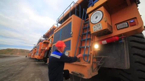 Worker at heavy dump truck Stock Footage 61851029