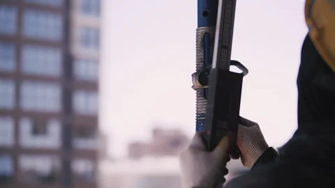 Worker in a helmet adjusts the height of the construction formwork Stock Footage 250809753