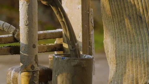 The worker, with his bare hands, lowers the dirty hose into the pipe Stock-Footage 122324470