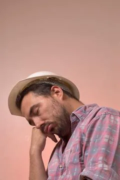 Worker with his respective protective helmet asleep on his right hand during Stock Photos