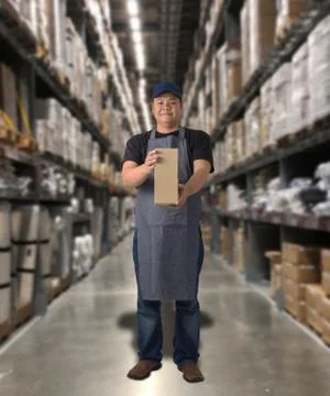 Worker holding parcel boxes Stock Photos