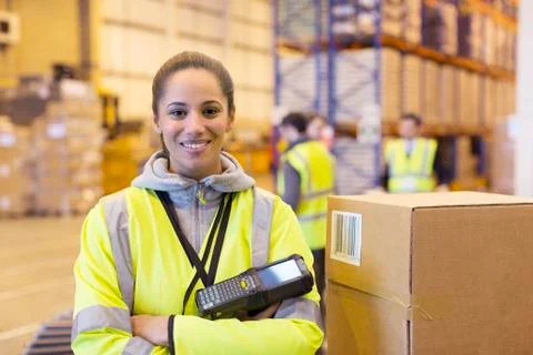 Worker holding scanner in warehouse Stock Photos