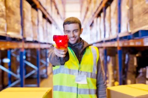 Worker holding scanner in warehouse Stock Photos