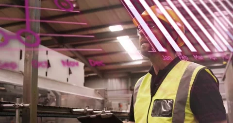 Worker holding tablet, reading data and doing factory safety check while magenta Stock Footage 333901294