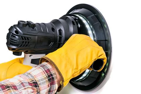 Worker holding a wall sanding machine Stock Photos