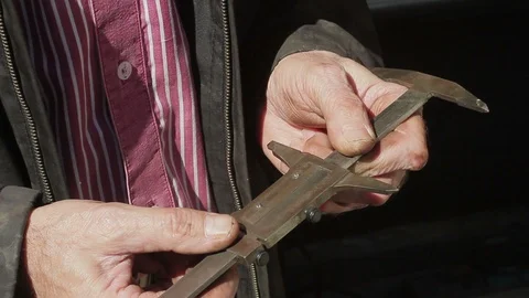 The worker holds a caliper in her hands Stock Footage 88343928