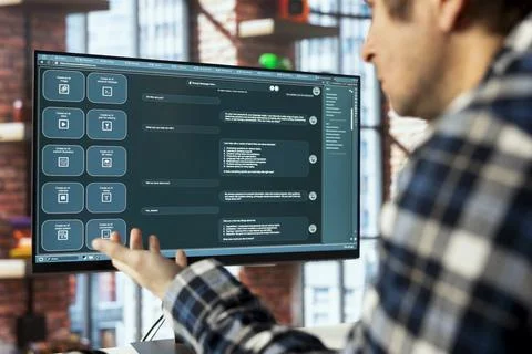 Worker in home office using AI chatbot designed to understand human language Stock-Fotos