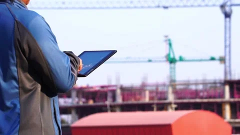 Worker at industrial plant typing on a tablet  스톡 동영상 147545718