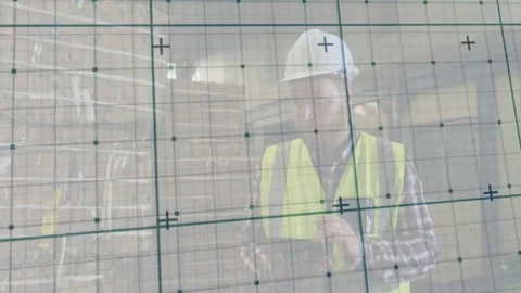Worker inspecting warehouse environment, showing digital grid overlay and Stock Footage 330479290