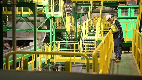 Worker Inspects Industrial Facility for Safety and Efficiency Measures Stock Footage 301977003