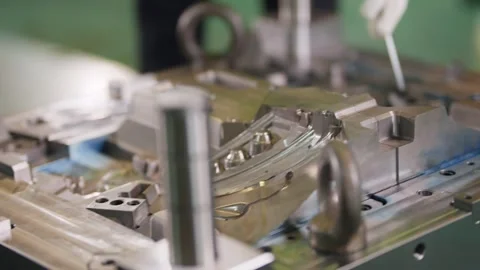 Worker inspects metal mold with care Stock Footage 341925689