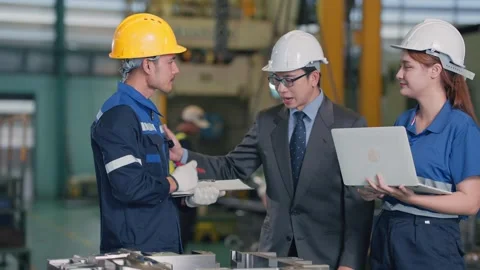 Worker inspects metal part with focused attention 스톡 동영상 345135465