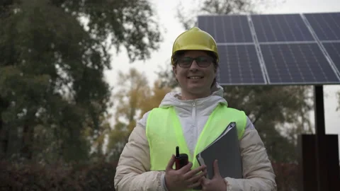 Worker inspects the solar panels and reports the information to the management Stock Footage 144357693