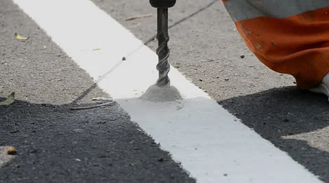 Worker install stud solar on road Stock Footage 23592908