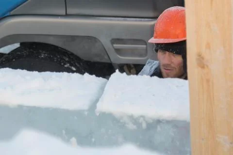 Worker on the installation of an ice panel Stock Photos