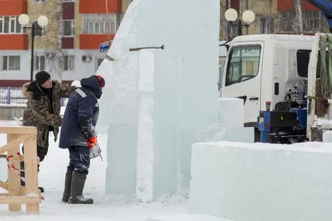 Worker on the installation of an ice panel 스톡 사진