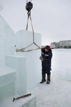 Worker on the installation of an ice panel Fotos Stock