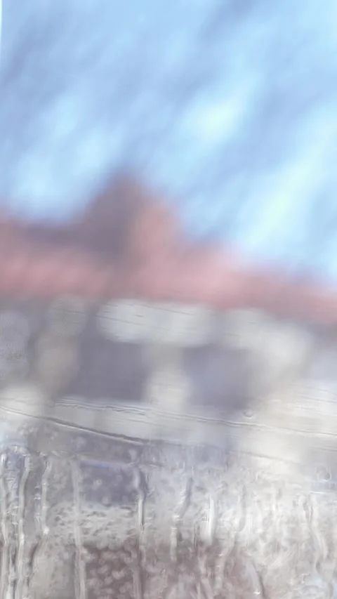 Worker installing and smoothing tint film on window at home. Man tinting windows Stock Footage 327097893