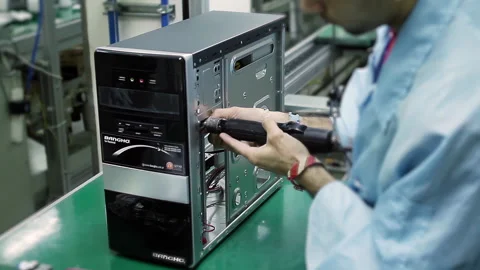 Worker Installing Components Into a CPU on a Computer Factory Assembly Line - 4K Stock Footage 304471673