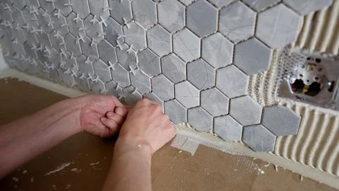 Worker Installing Hexagon Marble Tiles Stock Photos