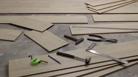 Worker Installing Interlocking laminate floor, home renovation. Stock Footage 204136510