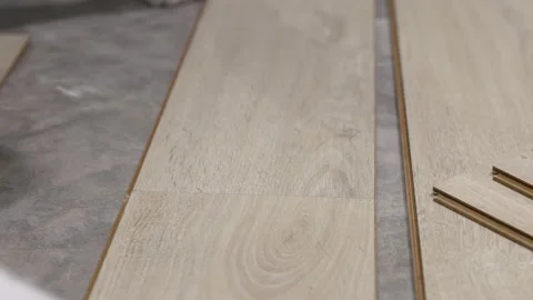 Worker Installing Interlocking laminate floor, home renovation. Stock Footage 204137119