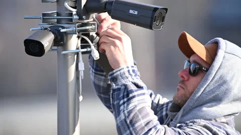 Worker Installing IP Cameras Residential Security Theme Stock Footage 147848689