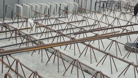 Worker Installing Joint Reinforcement Bars on Filigree Floor Slab Stock Footage 334062160