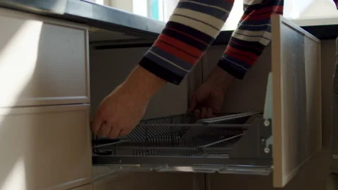 Worker Installing Metal Shelf Inside Kitchen Drawer Stock Footage 323911067