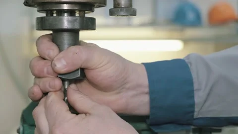 Worker installing a milling cutter on a milling machine. Stock Footage 150755453