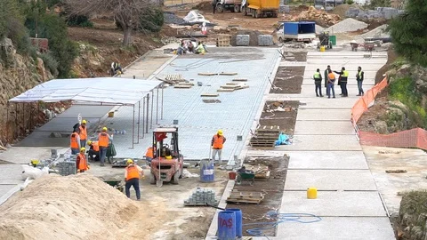 Worker installing old cobblestone block for build floor ground Video stock 86882686