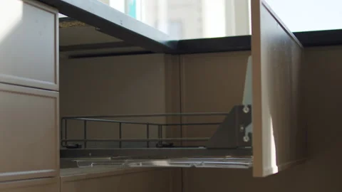 Worker Installing or Adjusting Kitchen Drawer During Cabinet Assembly Stock Footage 323911581