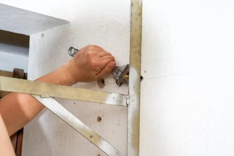 A worker is installing scaffolding Foto stock