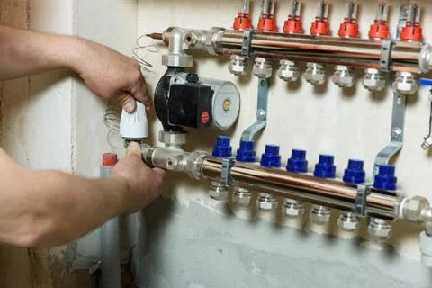 A worker is installing a thermal head. Stock Photos