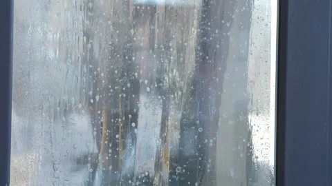 Worker installing tint film on window at home. Man tinting windows. Closeup Stock Footage 268328999