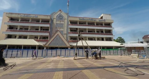 Worker installing wet-process bored pile for outside construction Stock Footage 91877898