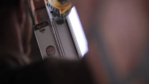 Worker installing window frame with electric drill on construction site Stock Footage 315957354