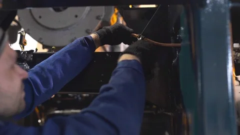 The worker installs the air suspension system to the heavy truck, complex Stock Footage 81976464