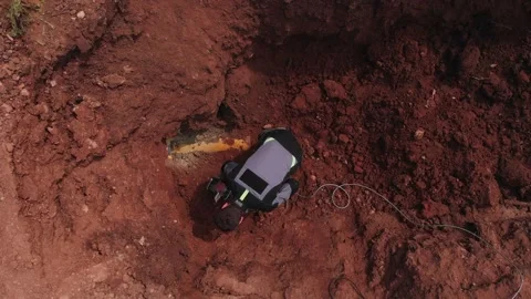 Worker installs seismographical sensor to check pipeline Stock Footage 142307175