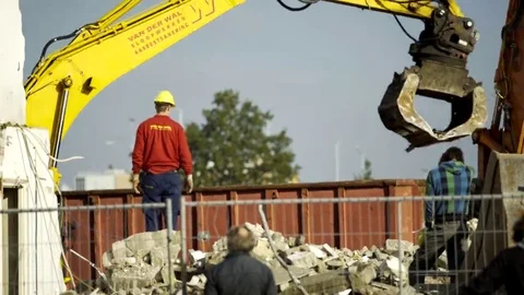 Worker instructing excavator - 4K Stock Footage 69177810